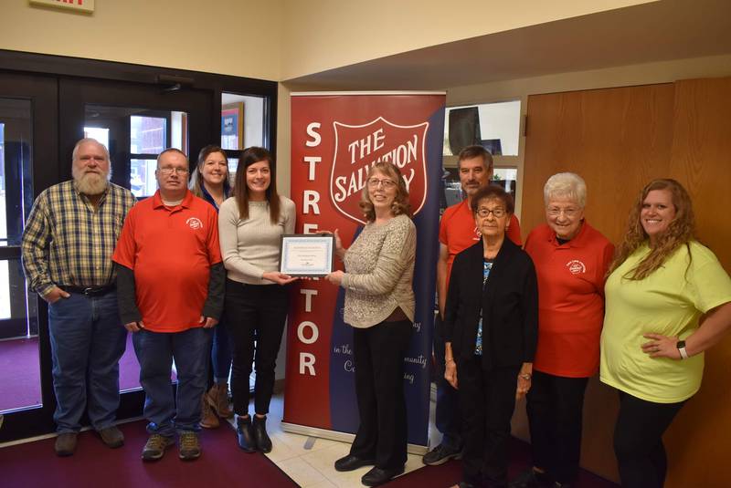 (Left to right) Rod Kreier (Salvation Army board member), Bev Yusko (Salvation Army board member), Dana Stillwell (chamber board), Judy Booze (Salvation Army director), Courtney Levy (Chamber executive director), Larry Booze (volunteer), Steve Soulsby (Salvation Army employee), Judy Soulsby (Salvation Army employee) and Megan Wright (Chamber membership services coordinator) celebrate the Salvation Army being named business of the month for November 2022 by the Streator Area Chamber of Commerce.