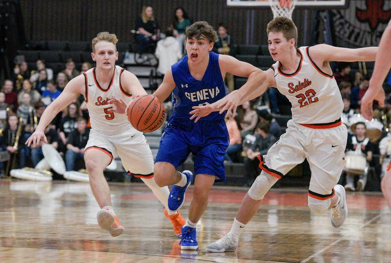 Geneva's Nathan Valentine (3) drives the ball down the court between St. Charles East's Luke Matheny (5) and St. Charles East's Zack Clodi (22) during varsity boys basketball in St. Charles Feb. 7 2020.
