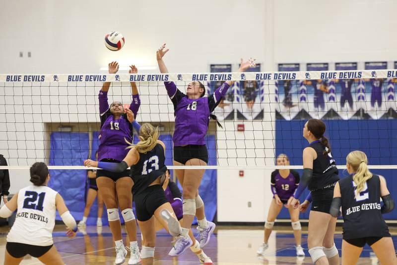 Manteno's Amelia Cabello, left, and Maddie Gesky reach to block a hit by Peotone's Mia Connolley during the Panthers' victory in three sets, 19-25, 25-19, 25-21, over Peotone on Tuesday, Sept. 23, 2025.