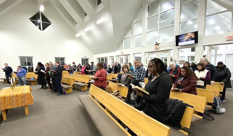 Crowd members sing the hymn "Lift Every Voice and Sing," during the annual Martin Luther King, Jr., Celebration on Monday, Jan. 20, 2025, at New Hope Missionary Baptist Church, 1201 Twombly Road, DeKalb.