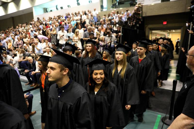 Wheaton Warrenville South graduates proceed into the gymnasium during the school’s 2022 Commencement Ceremony at the College of DuPage in Glen Ellyn on Saturday, May 28, 2022.
