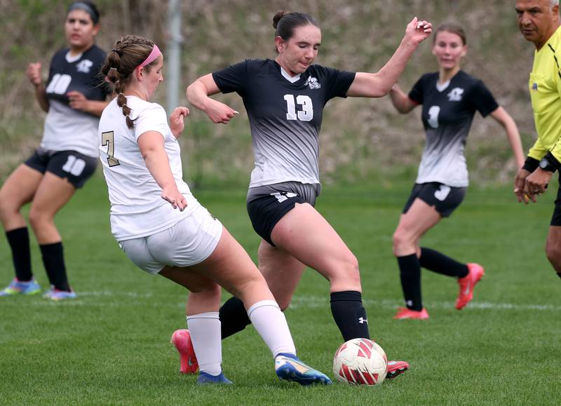Kaneland's Kyra Lilly (right) tries to steal the ball from Sycamore's Anya Berry Wednesday, April 30, 2025, during their game at Kaneland High School in Maple Park.