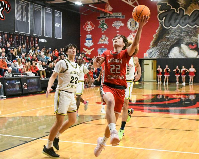 Aurora Christian's Jacob Baumann (22) makes a basket during the game on Friday Feb. 28, 2025, while taking on Yorkville Christian during the regional title game held at Indian Creek High School.