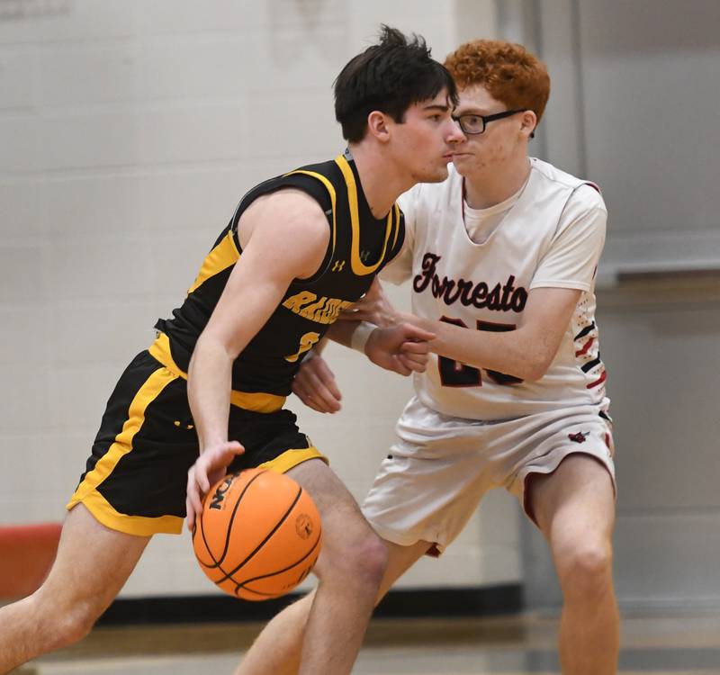AFC's Chase Near drives to the basket as Forreston's Noah Genandt defends on Saturday, Jan. 17, 2026 at Forreston High School.