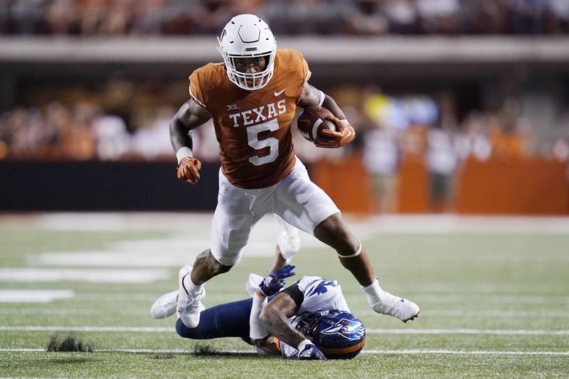 Texas running back Bijan Robinson runs for a first down against UTSA during the 2022 season in Austin, Texas.Robinson ranks among the best overall prospects in the NFL draft.