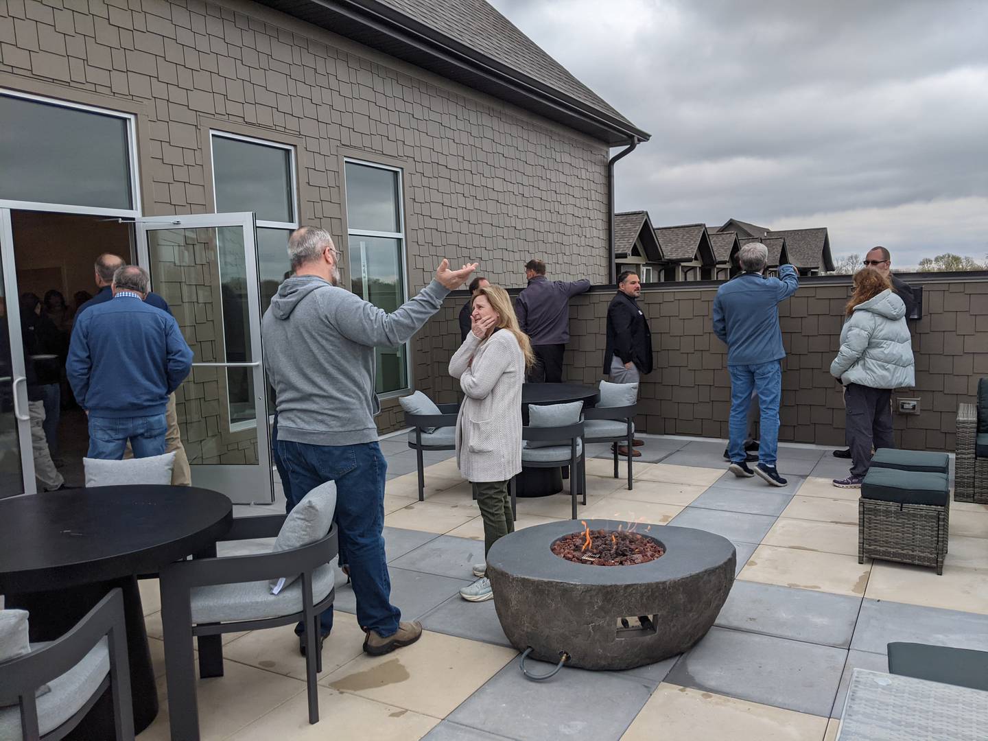 Those attending the grand opening of The Reserve at Hudson Crossing North in downtown Oswego on April 10, 2026, check out the rooftop deck on the building.