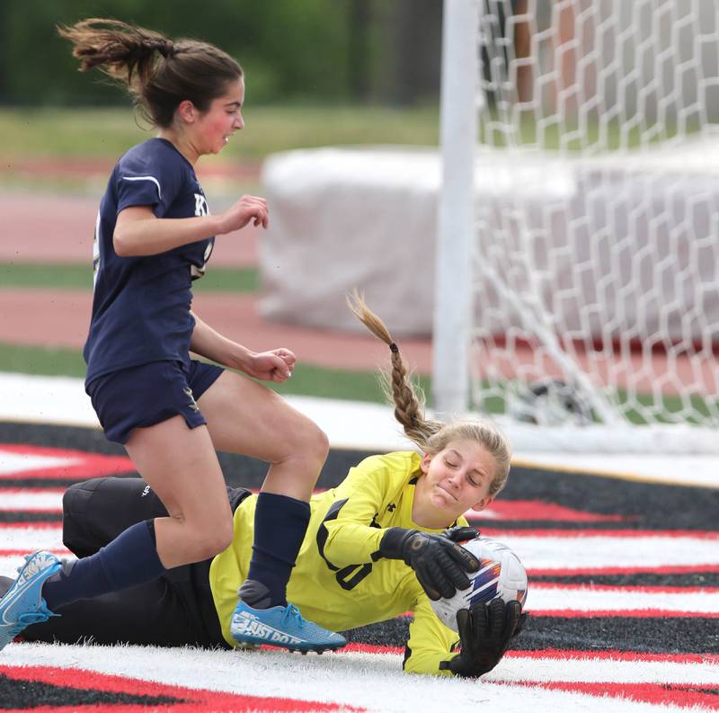 IC Catholic Prep's Brynn Laluya runs into Pleasant Plains' goalie Elle Walker during the IHSA Class 1A state girls soccer third place game Saturday, May 27, 2023, at North Central College in Naperville.