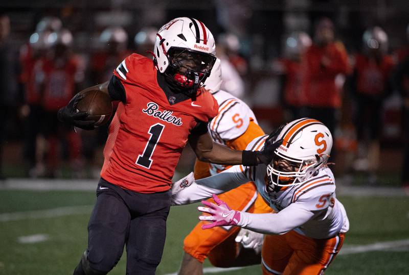 Bradley-Bourbonnais' Kyren Edmon carries the ball on a play as a Shephard defender tries for the tackle in a Class 6A playoff game on Friday, October 31, 2025.
