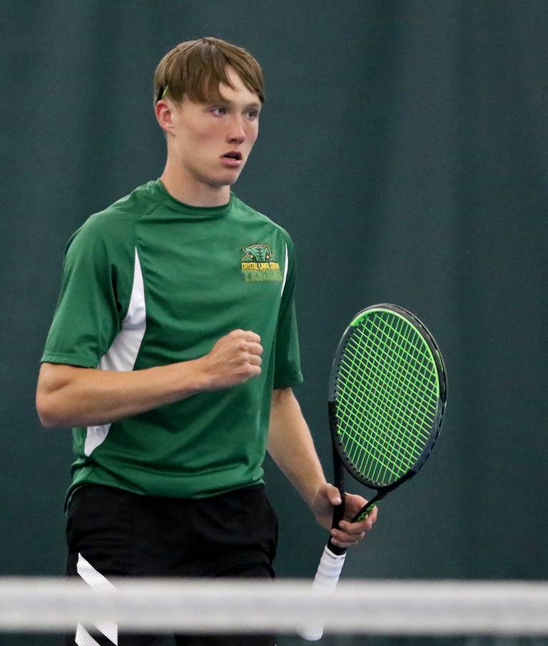 Crystal Lake South's Jackson Schuetzle pumps his fist after scoring a point against Jacobs' Thomas Nelson in the Fox Valley Conference boys tennis tournament singles finals at The Racket Club on Friday, May 28, 2021 in Crystal Lake.