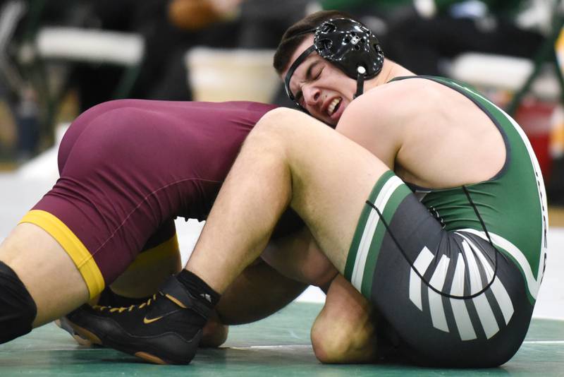 Coal City's Mason Garner, right, defends a move from Norridge Prep's Adam Haddad during the 165-pound championship match of the IHSA Class 1A Coal City Sectional Saturday, Feb. 15, 2025.