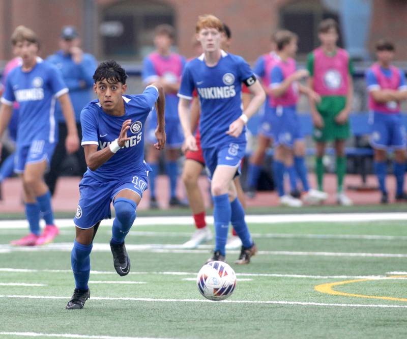 Geneva’s Nick Plata goes after the ball during a Tri-Cities Night game against Batavia at St. Charles North High School on Thursday, Sept. 21, 2023.