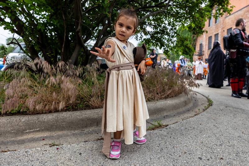 Four-year-old Bartlett resident Adeline Solis does her best Rey Skywalker impression during Joliet Public Library's Star Wars Day event on June 7, 2025.