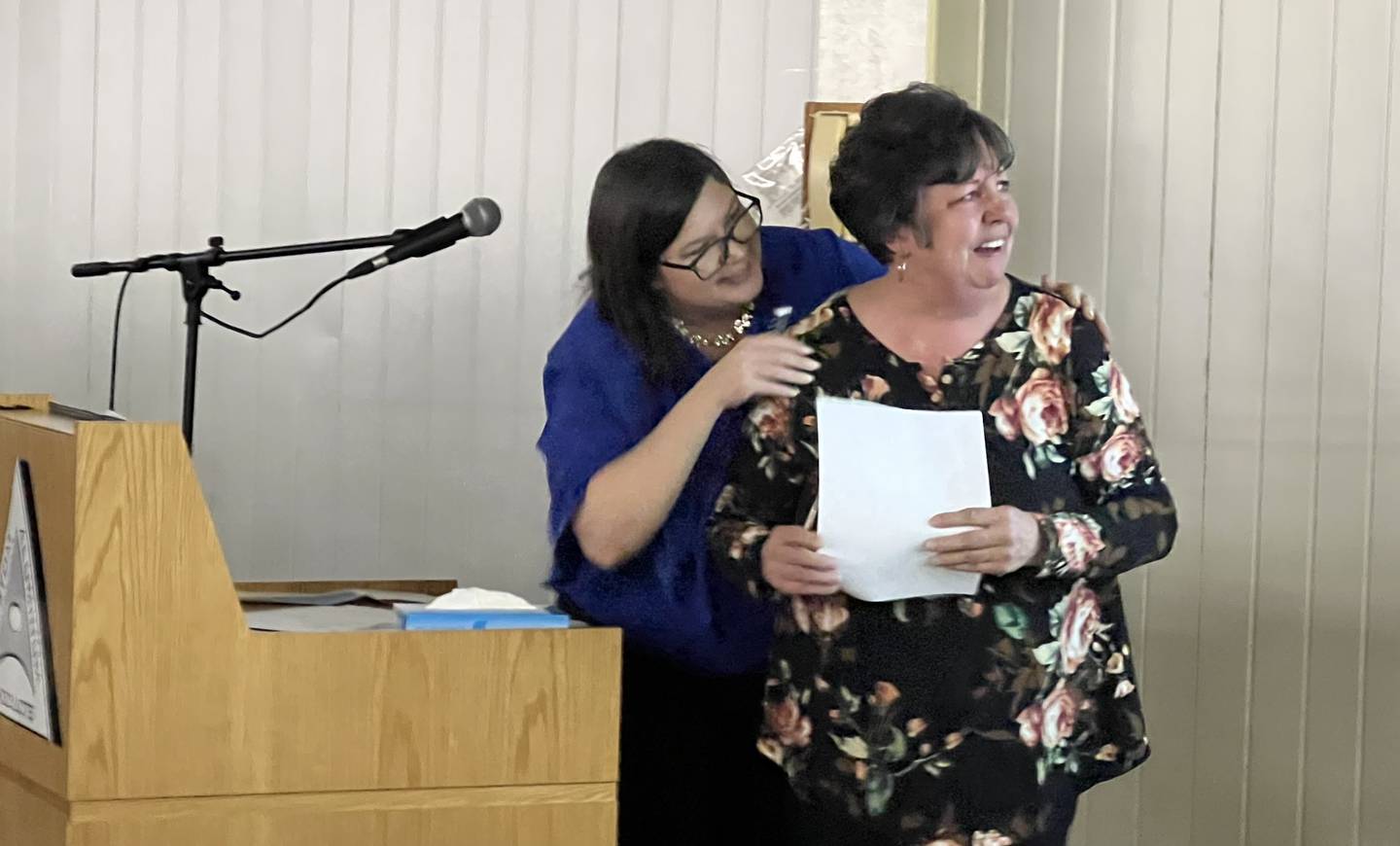 Carolyn Tobinson, right, the daughter of Dave Tobinson, reacts as Krissy Johnson, left announced her as the winner of Genoa Chamber of Commerce's 2022 Dave Tobinson, Outstanding Member of the Year Award on Feb. 15, 2023.