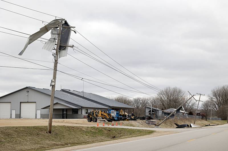Derbis is seen tangled in power lines outside of Amboy Saturday, April 1, 2023 the day after a line of powerful storms roared through the Sauk Valley.