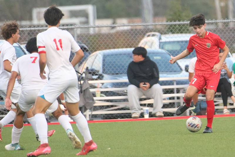L-P's Adrian Gonzalez kicks the ball toward the goal against Ottawa defenders on Monday, Oct. 6, 2025 at the L-P Athletic Complex in La Salle.