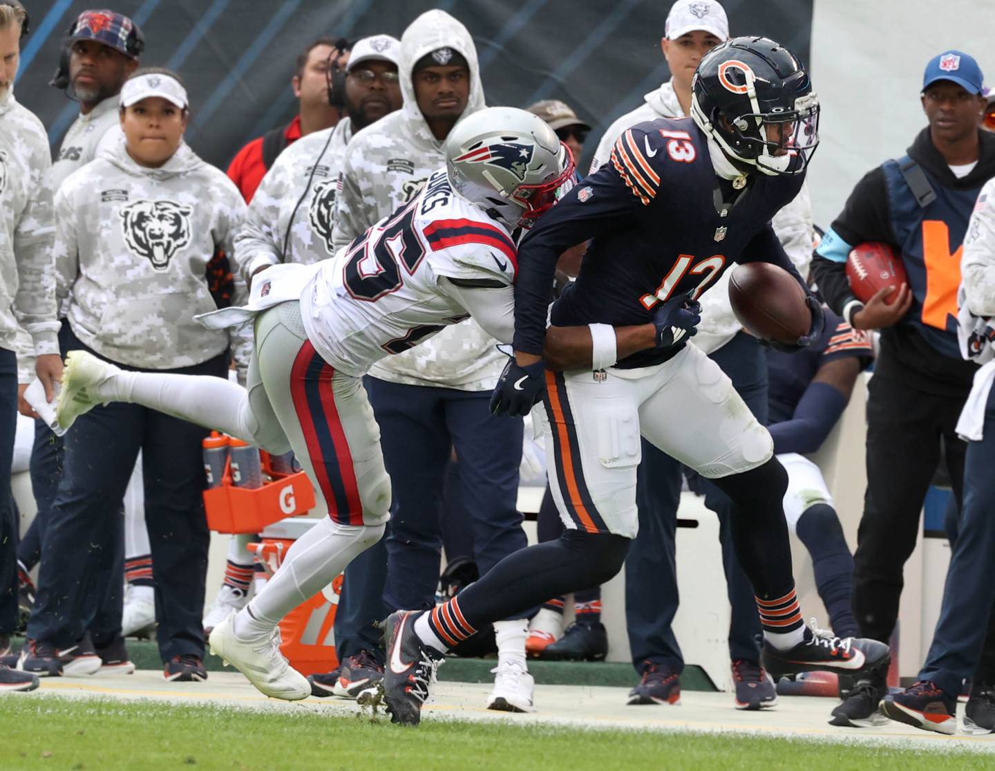Chicago Bears wide receiver Keenan Allen is pushed out of bounds by New England Patriots cornerback Marcus Jones after a catch during their game Sunday, Nov. 10, 2024, at Soldier Field in Chicago.