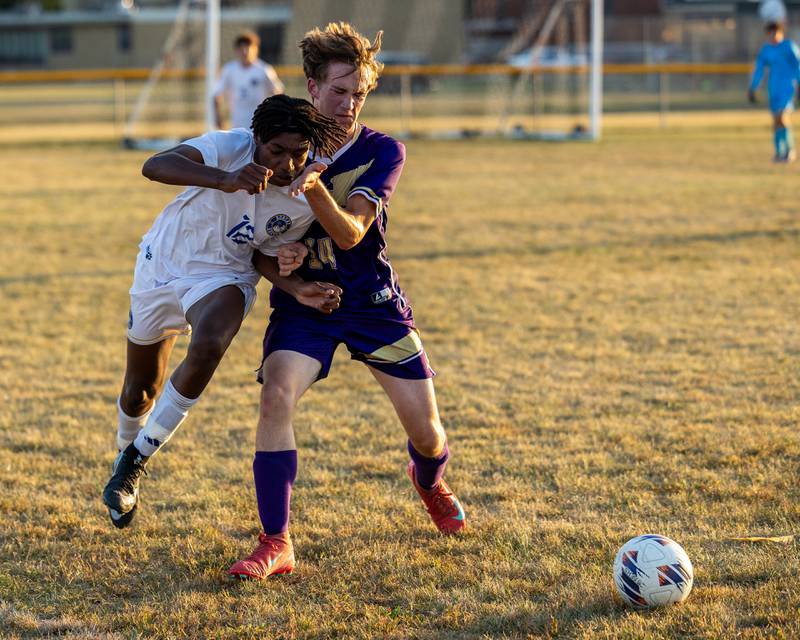 Jackson Brockway (12) of Somonauk/Leland/Newark is pushed by Caleb Collins (14) of Serena as they fight over possession of ball on Monday, Sept. 29, 2025, at Serena High School in Serena.