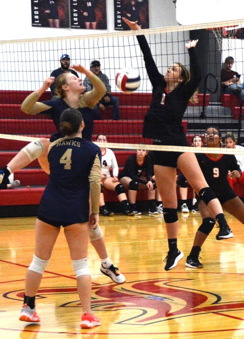 LaMoille's Grace Kelly makes a play at the net against Hiawatha Tuesday at Dean Madsen Gymnasium at LaMoille.