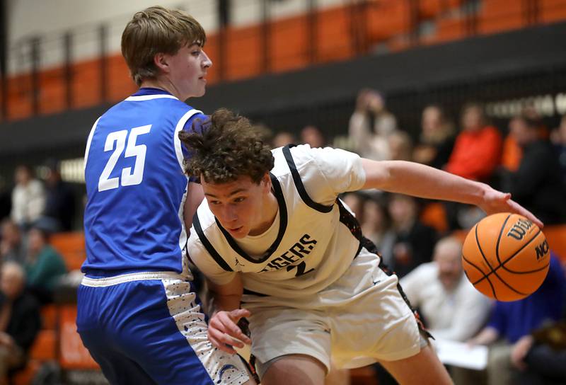 Crystal Lake Central's Danny Spychala tries to drive the baseline against Woodstock's Liam Laidig  during a nonconference boys basketball game on Monday Jan. 5,  2026, at Crystal Lake Central School.