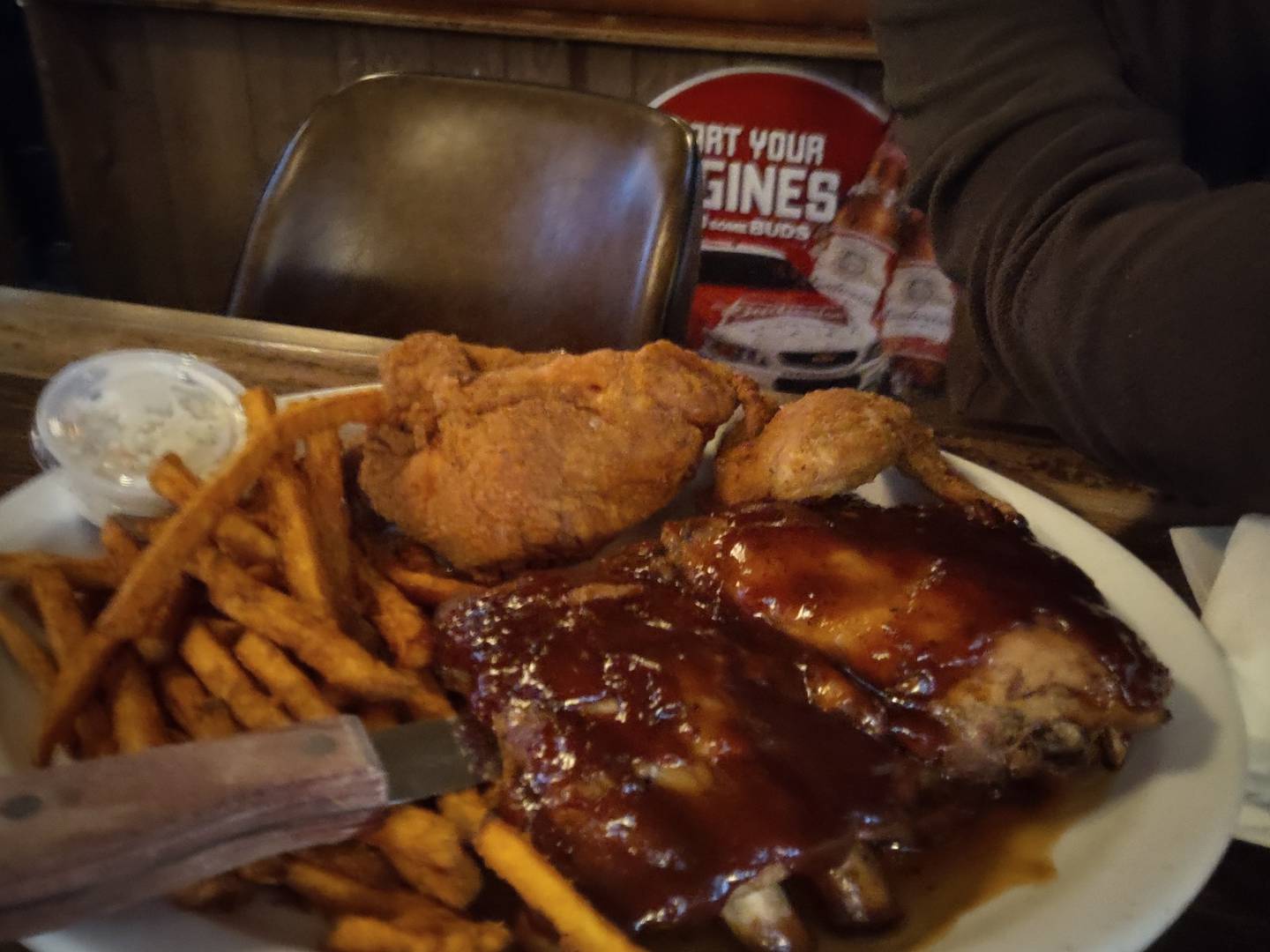 Fried chicken and ribs at Labemi's in downtown Crystal Lake. The sides include sweet potato fries and coleslaw.