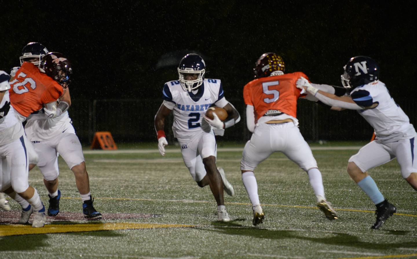 Nazareth's Justin Taylor runs the field during their game against Montini Friday Oct 14, 2022.