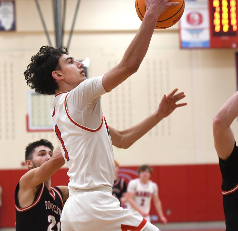 Oregon's Benny Olalde drives in for a lay up against Forreston on Tuesday, Feb. 17, 2026 at the Blackhawk Center in Oregon.