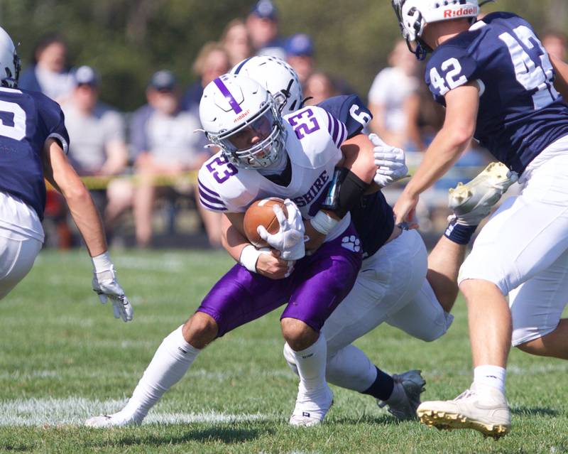 Hampshire's Jaxon Currie is tackled by Cary Grove's Charles Ciske on Saturday Oct. 5,2024 in Cary.