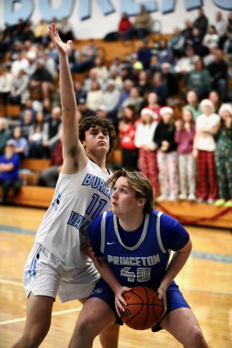 Princeton's Jordan Reinhardt looks to shoot over Bureau Valley's Logan Philhower at the Storm Cellar Thursday night. The Storm won 62-56.