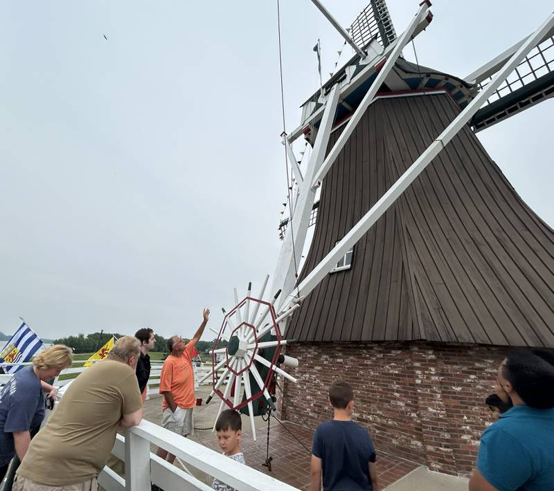 Dale Green, a volunteer miller for de Immigrant windmill in Fulton, talks to a tour group during the 25th anniversary celebration Saturday, June 7, 2025. Tours of the windmill were just one of the activities offered during the day.