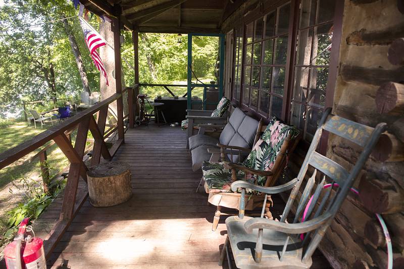 A large porch overlooks the Rock River and the cabin’s namesake Goose Island.