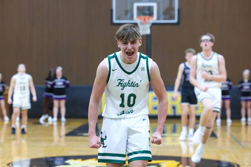 Bishop McNamara's Coen Demack celebrates a dunk by teammate Callaghan O'Connor, right, in the fourth quarter during the Fightin' Irish's 66-52 victory over El Paso-Gridley in the IHSA Class 2A Herscher Regional championship on Friday, Feb. 27, 2026.