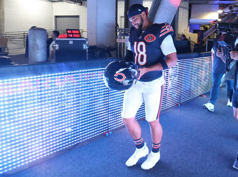 Chicago Bears quarterback Caleb Williams smiles before stepping on the field for the second preseason game against the Buffalo Bills on Sunday, Aug. 17, 2025 at Soldier Field in Chicago.