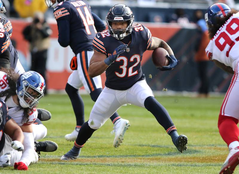 Chicago Bears running back David Montgomery finds a hole in the New York Giants defensive line during their game Sunday, Jan. 2, 2021, at Soldier Field in Chicago.