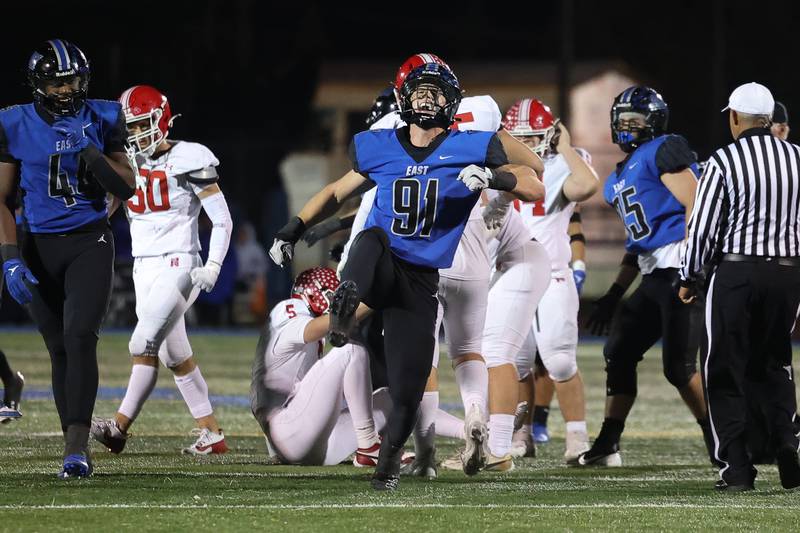 Lincoln-Way East’s Caden O’Rourke celebrates his sack to end a drive by Naperville Central on Friday, Oct. 25, 2024 in Frankfort.