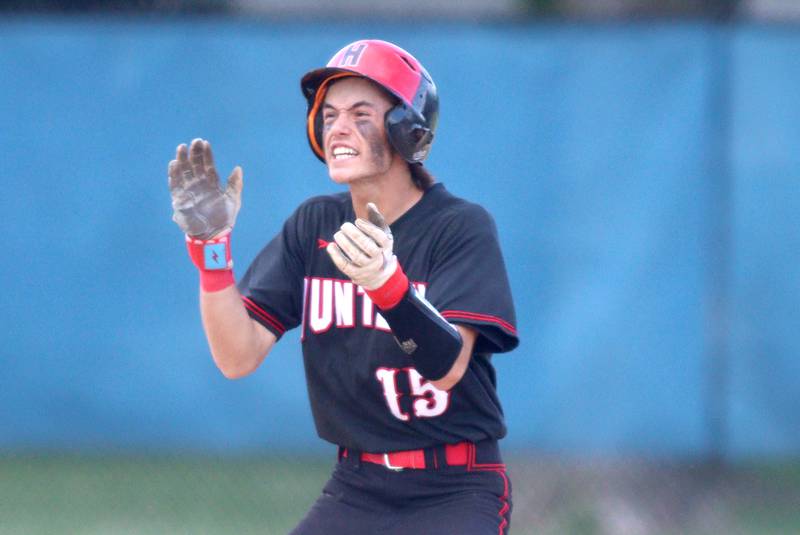 Huntley’s Griffin Goldstein gets revved up after belting a double against Jacobs in Class 4A Sectional baseball action at Carpentersville Wednesday.