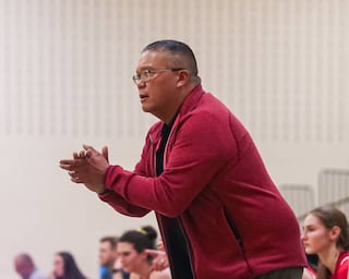 Hinsdale Central's head coach Ryan Sasis encourages the team during basketball game between Hinsdale Central at York. Dec 8, 2023.