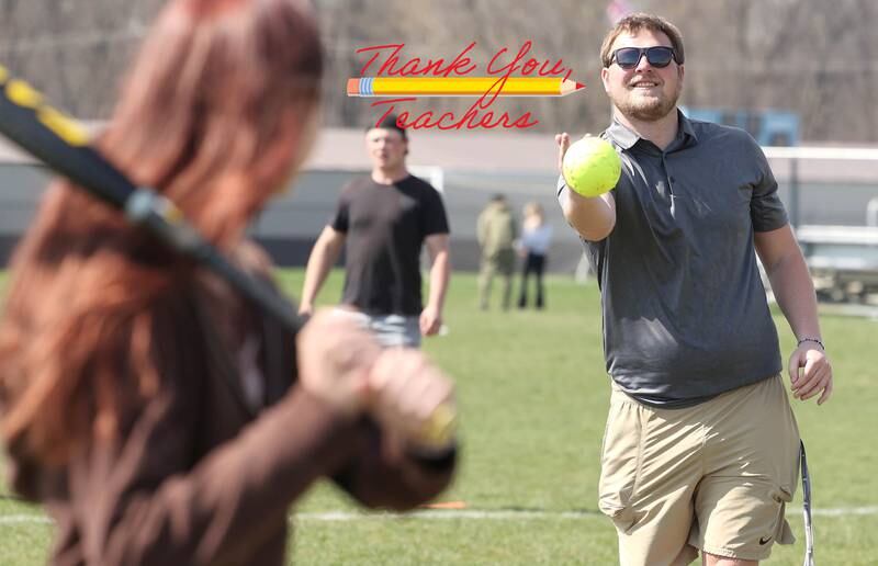 Griffin McNeal, Genoa-Kingston High School physical education teacher, pitches to students in his class Thursday, April 13, 2023, as they get outside to play some softball.