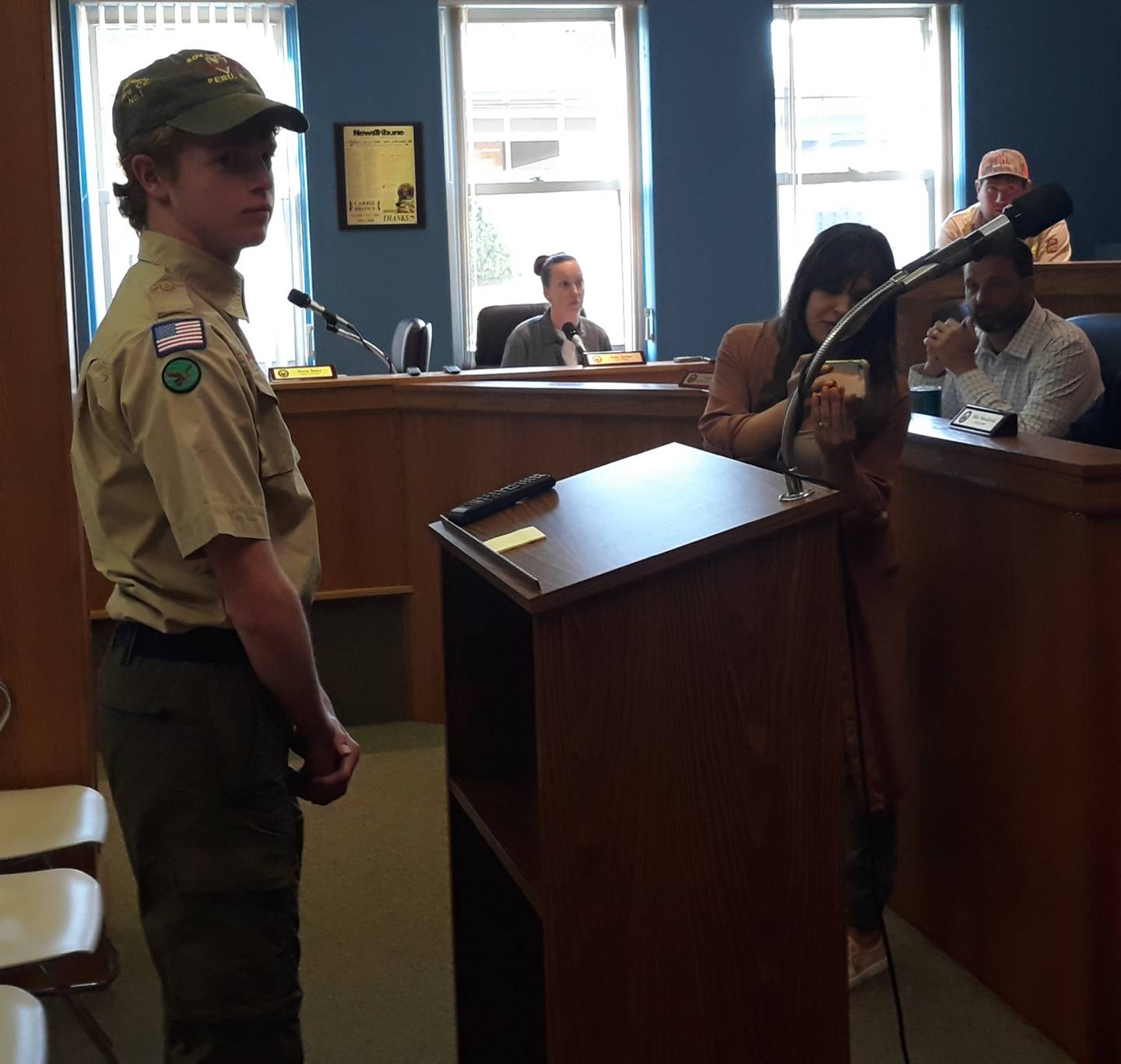 Cooper Vaske listens to La Salle City Engineer Brian Brown (not in photo) as he is introduced and commended Monday, May 16, 2022, by the La Salle City Council for his Eagle Scout project building bridges at Rotary Park for the disc golf course.