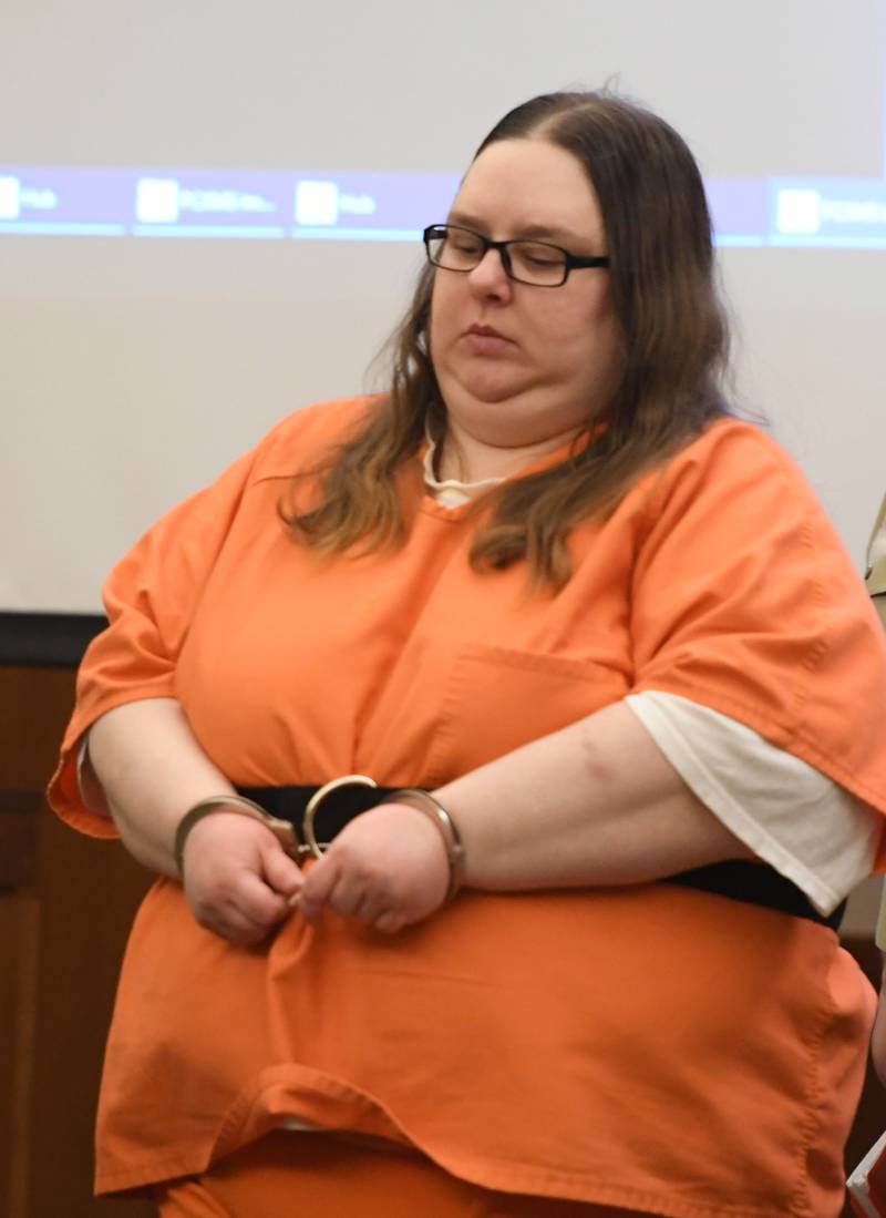 Sarah Safranek is escorted into an Ogle County courtroom on Wednesday for a status hearing. She is charged with killing her 7-year-old son.