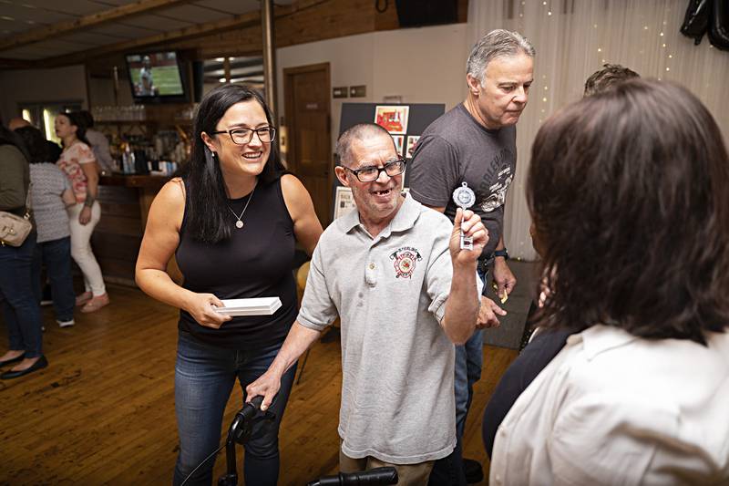 Merlin shows off the key to the city presented to him by Sterling mayor Diana Merdian (left) Sunday, Sept. 17, 2023 during this birthday party.