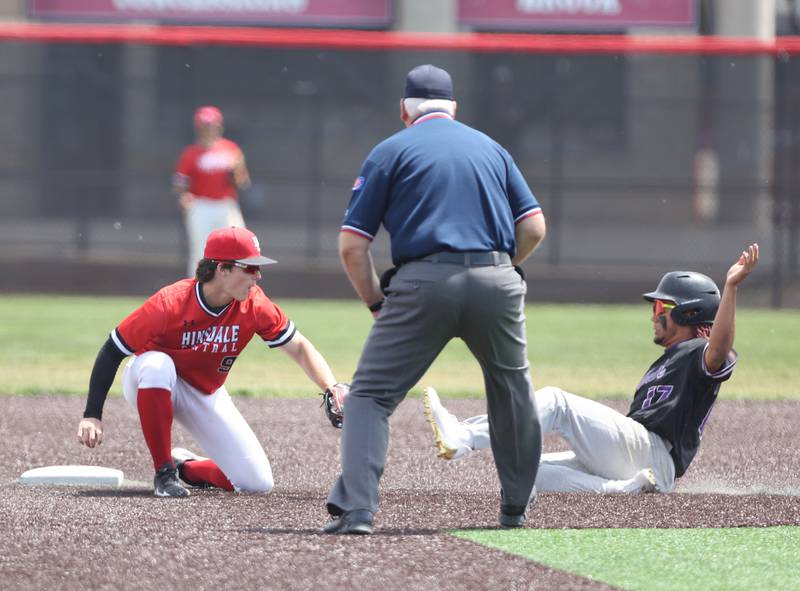 Downers Grove North's Noah Battle (17) slides into second as Hinsdale Central's Luke Jurack (9) tries to apply the tag during the IHSA Class 4A baseball regional final between Downers Grove North and Hinsdale Central at Bolingbrook High School on Saturday, May 27, 2023.
