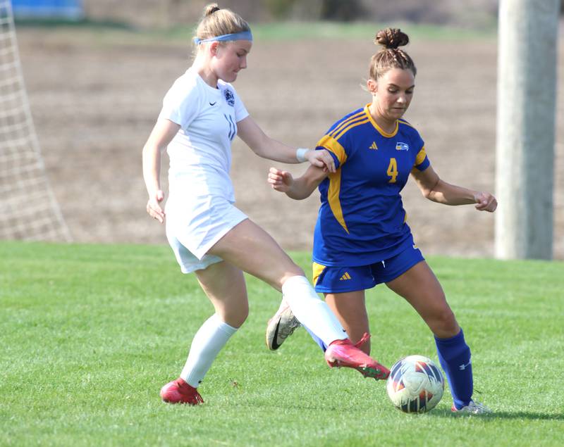 Johnsburg’s Ava Jablonski, right, battles Woodstock’s Kendall Pope in varsity soccer on Wednesday, April 23, 2025, at Johnsburg High School in Johnsburg.