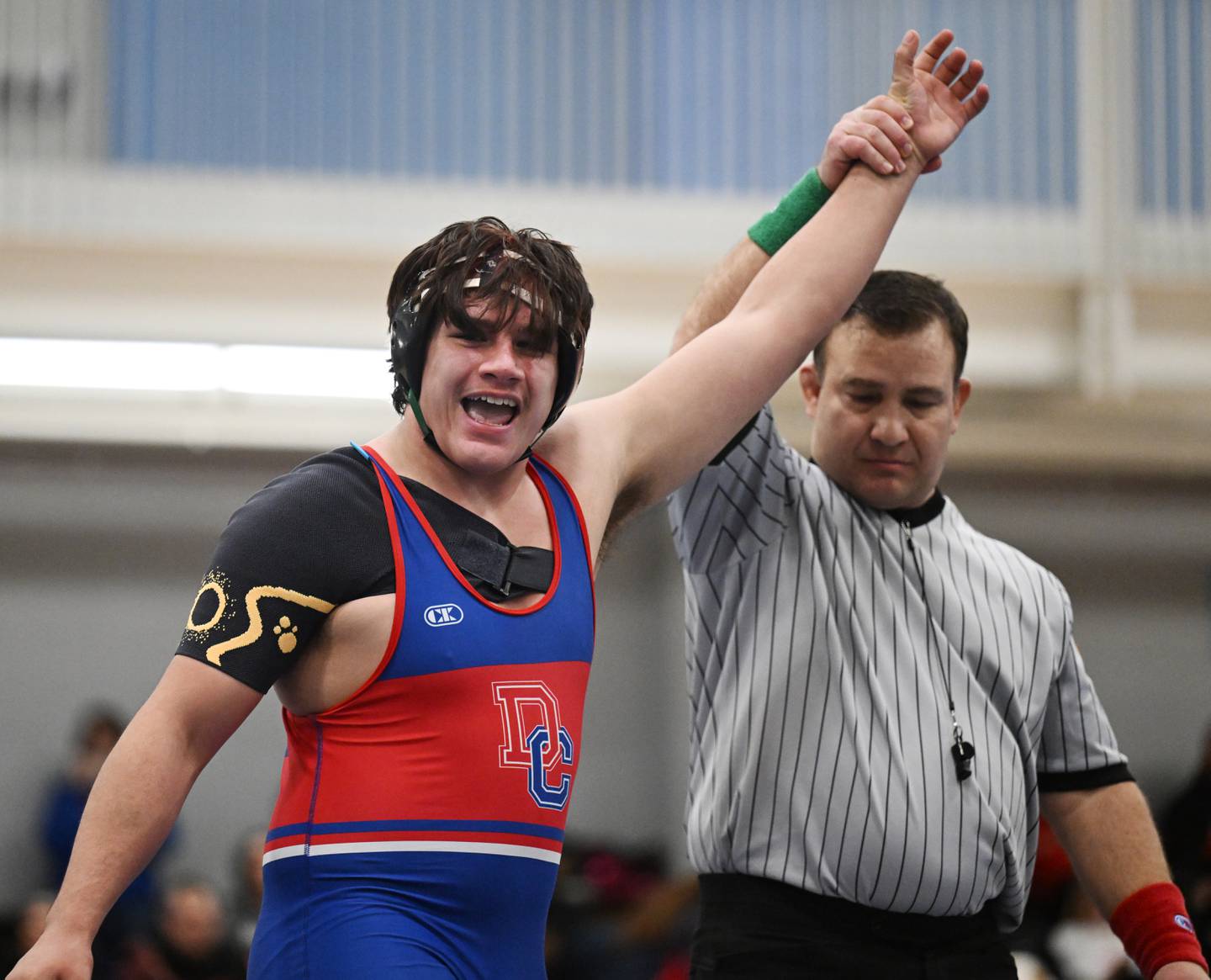 Dundee-Crown’s Teigen Moreno celebrates his win over Lake Zurich’s Rocco DiCanio in the 215-pound final of the Fremd Class 3A wrestling meet, which took place at Harper College on Saturday, Jan. 31, 2026 in Palatine.