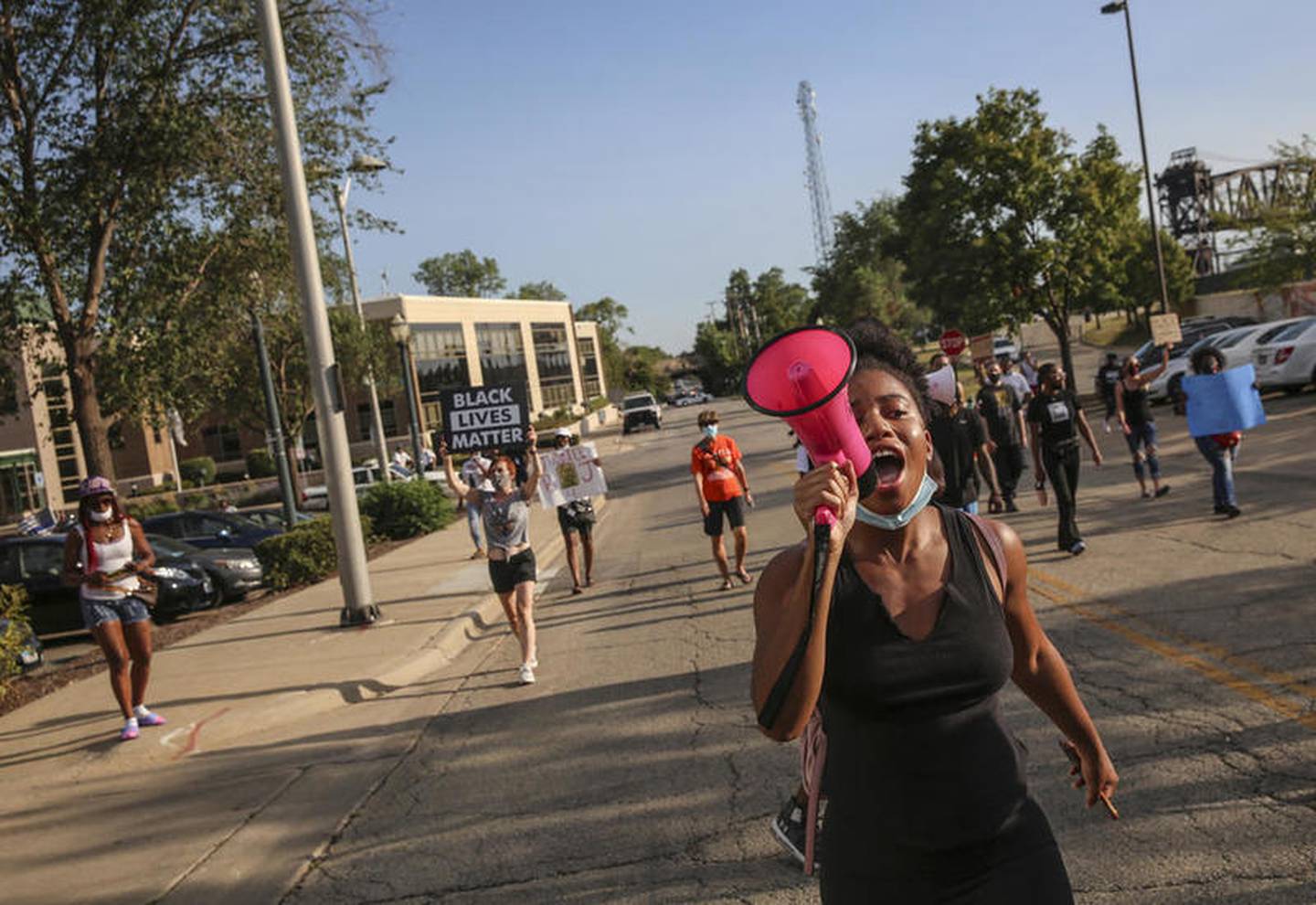 Demonstrators can be seen protesting outside Joliet City Hall, the Will County Courthouse and the Joliet Police Department on Saturday, Aug. 22, 2020, in response to the January 28 overdose death of Eric Lurry who died in police custody.