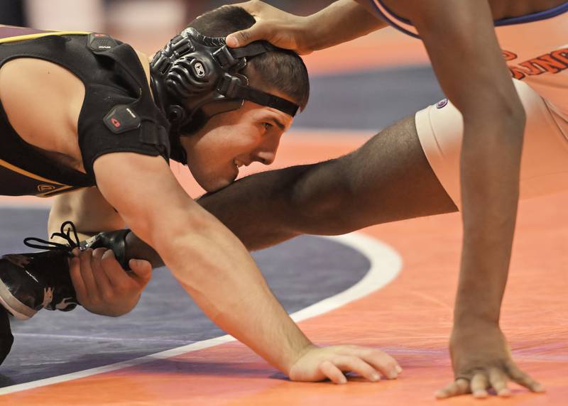 Montini’s Santino Tenuta  wrestles East St. Louis’s Pierre Walton in the Class 2A 165-pound final at the IHSA boys state wrestling championships at the State Farm Center in Champaign on Saturday, Feb. 22, 2025.