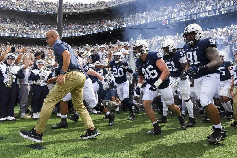 Penn State head coach James Franklin leads his team onto the field for an NCAA college football game against Ohio , Saturday, Sept. 10, 2022, in State College, Pa. (AP Photo/Barry Reeger)