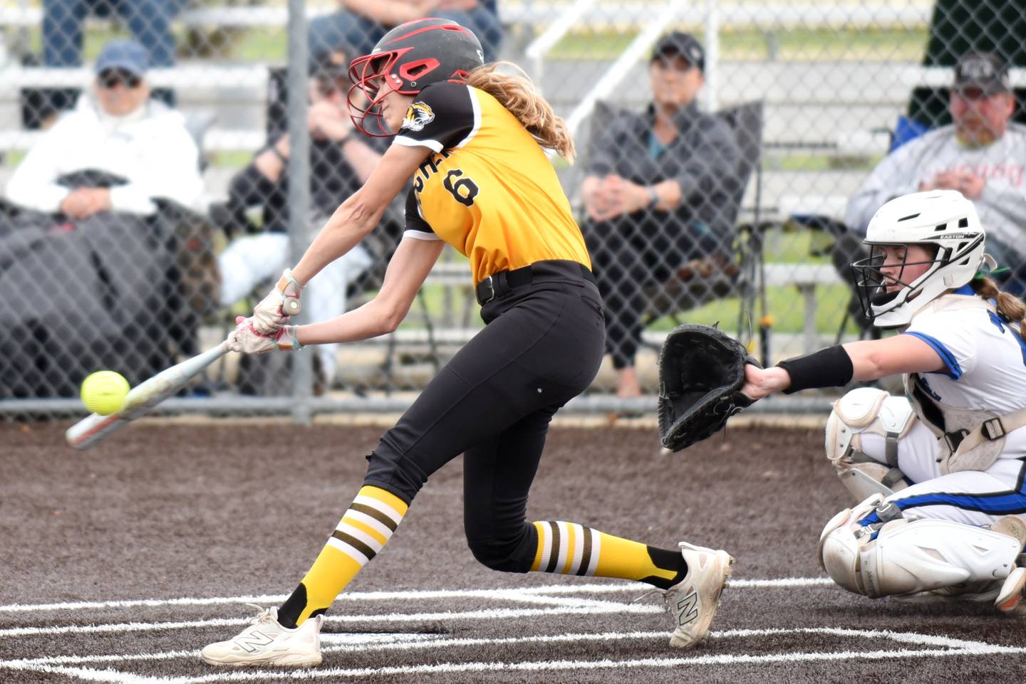 Herscher's Lexi Crawford connects on a pitch for a three-run triple during a Class 2A Manteno Regional quarterfinal against Peotone at Herscher Monday, May 18, 2026.