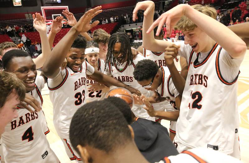 DeKalb players celebrate their win over Sycamore Friday, Jan. 26, 2024, during the FNBO Challenge in the Convocation Center at Northern Illinois University.