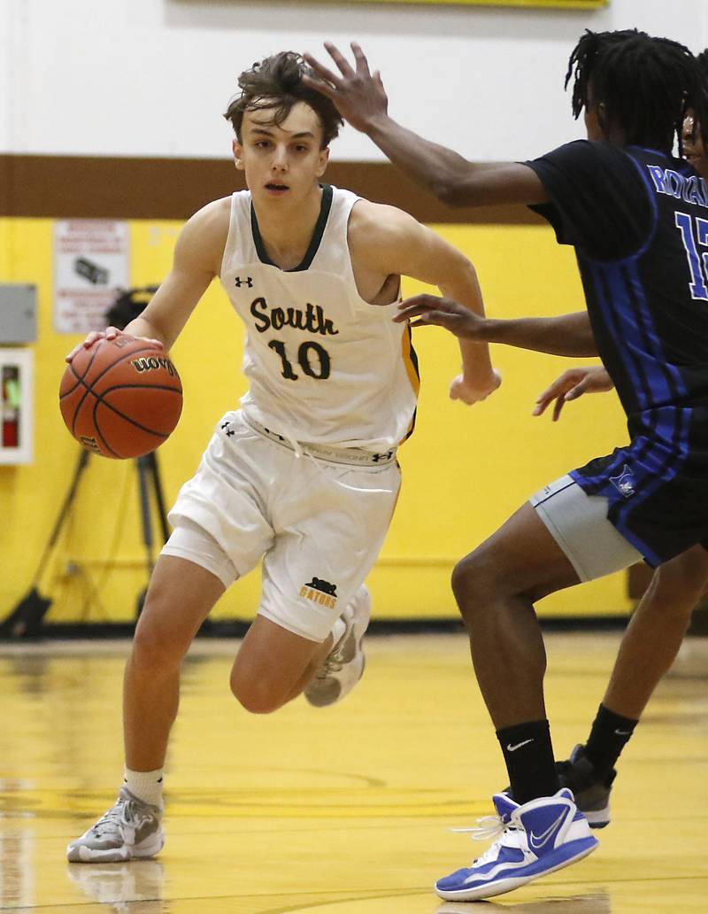 \cls10 drives the lane against Larkin’s Andre Jones during a Hinkle Holiday Classic basketball game Wednesday, Dec. 28, 2022, at Jacobs High School in Algonquin.