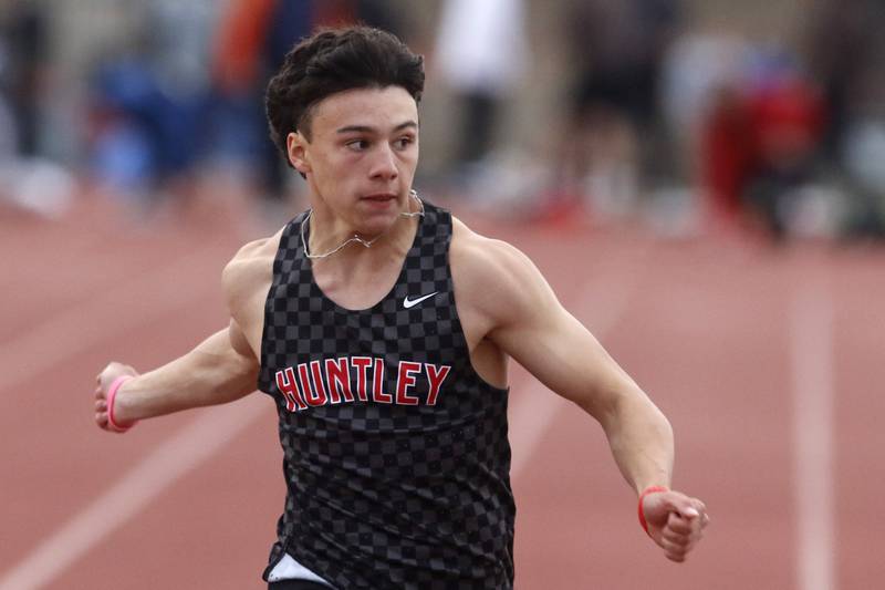 Huntley’s Vinny Costa over as the clock as he wins the 100 meter dash during the Fox Valley Conference Boys Track and Field Meet on Thursday, May 9, 2024, at Huntley High School.